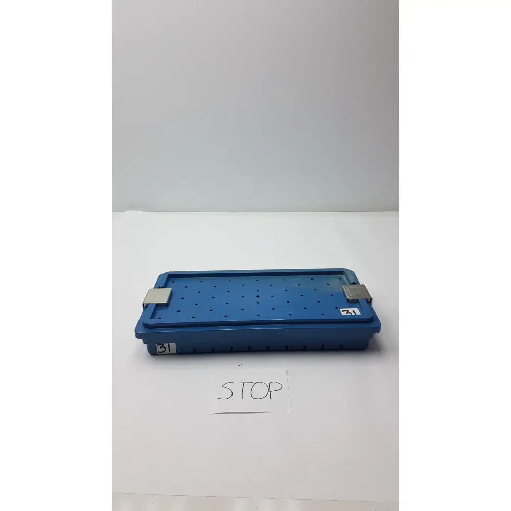 Blue plastic instrument set case with perforated surface and metallic latches for case container sterilization storage