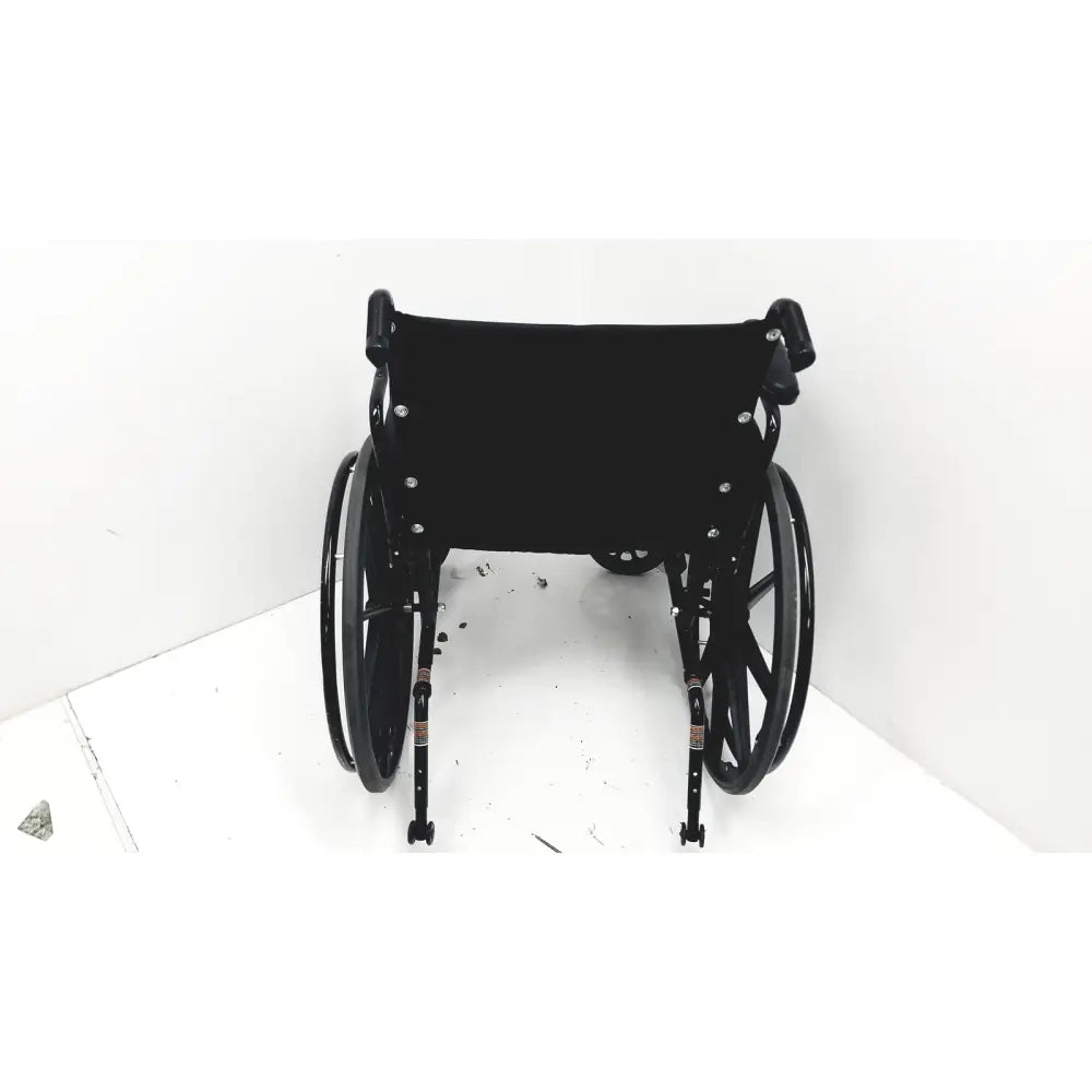 Black metal invacare tracer sx5 manual wheelchair with black fabric seat and backrest designed for adult use