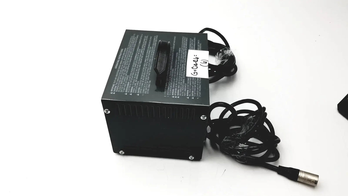 Black rectangular invacare wheelchair 24 volt automatic battery charger with coiled cables and metallic connector