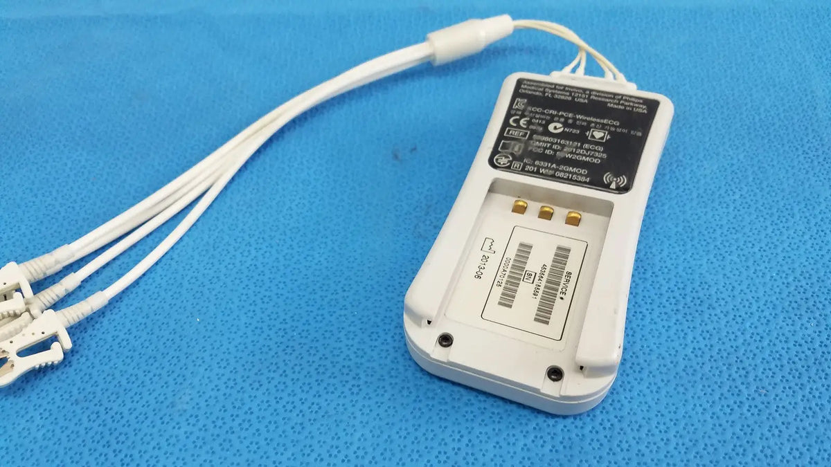 White plastic wireless ecg module with three white cables and connectors by invivo medical for cardiac monitoring