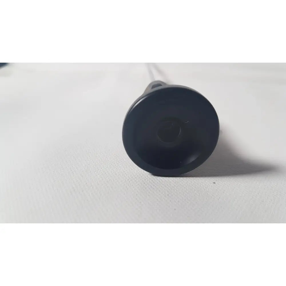 Black plastic suction cup with smooth rounded surface and tapered base for karl storz 70 degree cystoscope reuse medical device