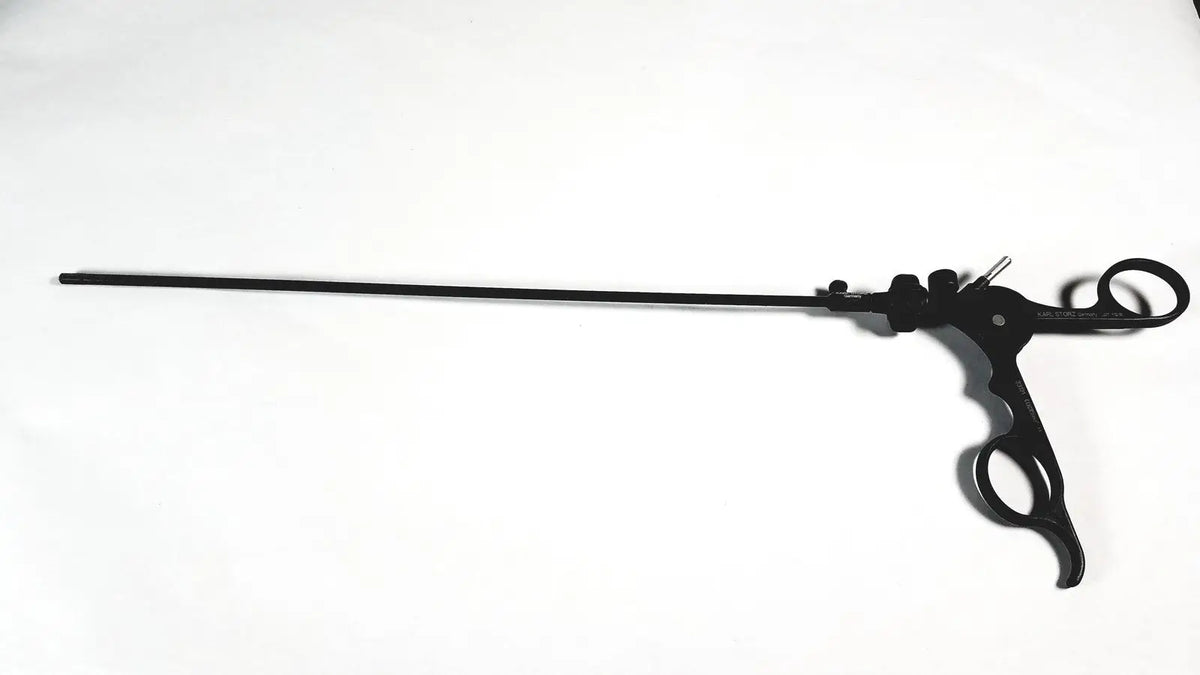 Black karl storz clickline laparoscopic grasper insert with ergonomic handle and two circular grips for surgical use