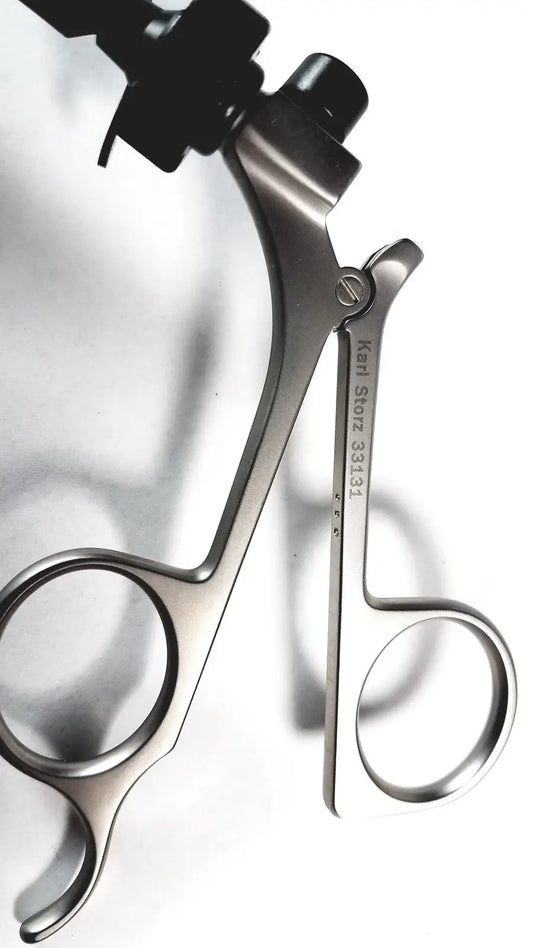 Stainless steel karl storz clickline handle with black ergonomic grips and engraved brand name for shaft laparoscopic surgical use
