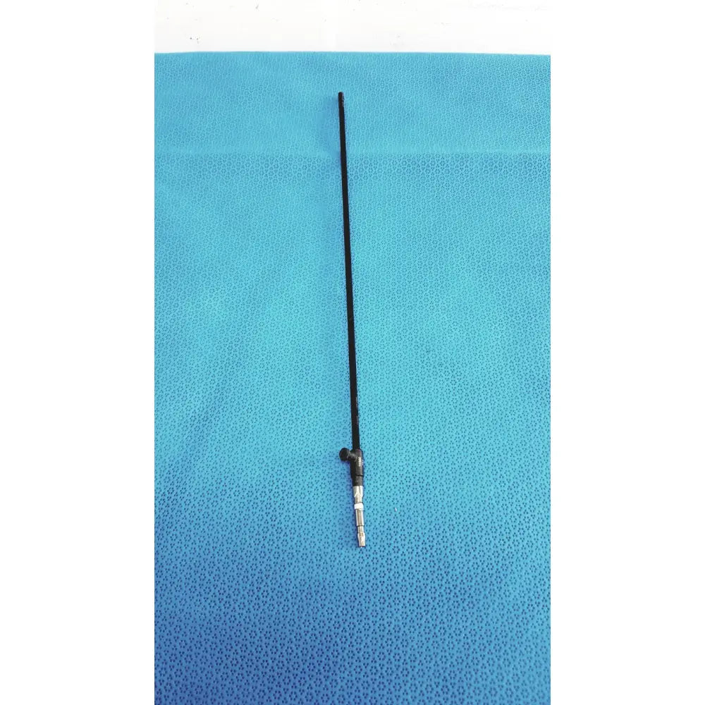Black flexible antenna with metallic connector at base of karl storz clickline insulated outer sheath surgical instrument