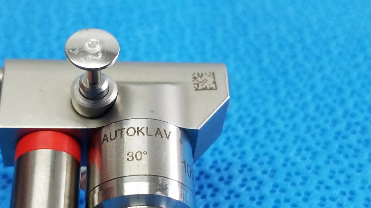 Silver metallic karl storz hopkins 30º autoclavable telescope with red-capped tubing and 30-degree angle autoklav sterilizer