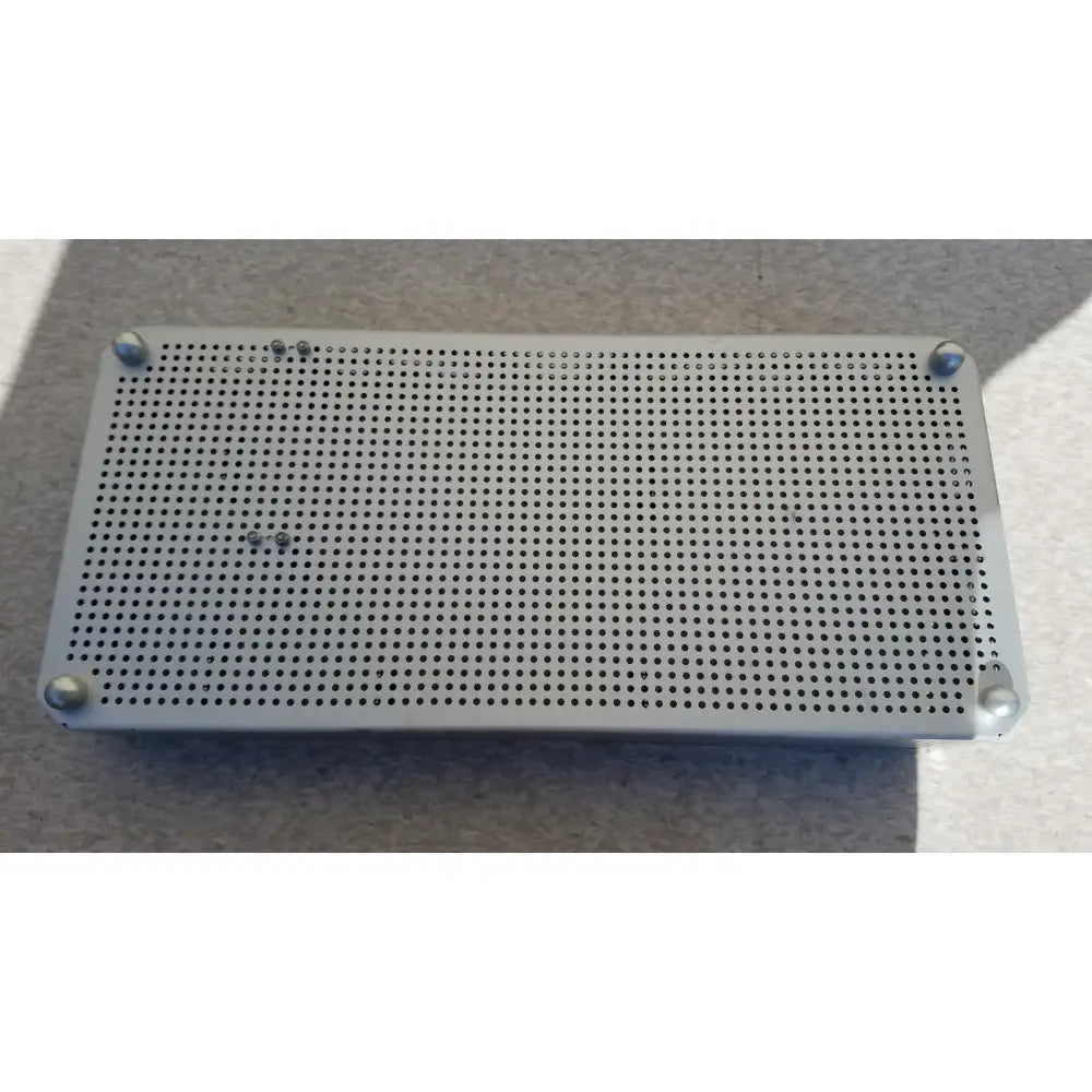Silver perforated metal tray with rounded corner caps for karl storz sterilization container case instrument use