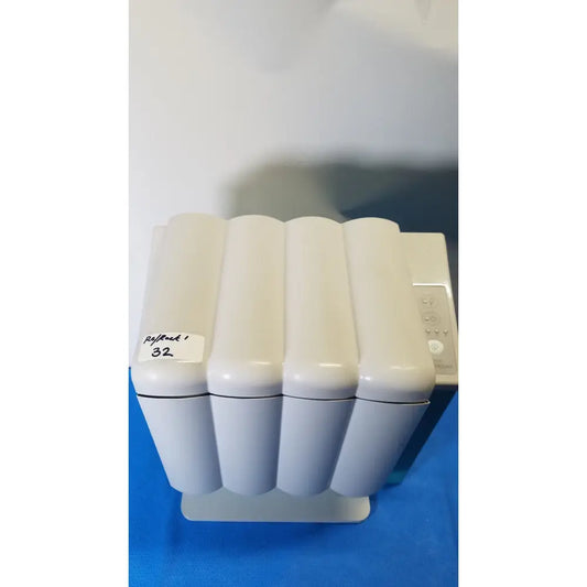 White ribbed plastic humidifier with control panel on right side of kavo quattrocare 2104a dental handpiece unit