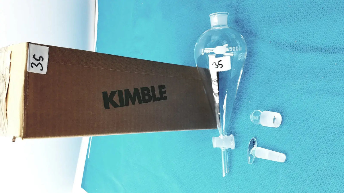 Clear glass kimax glass separatory funnel 500 ml with narrow neck, graduated markings, PTFE stopcock, and glass stopper