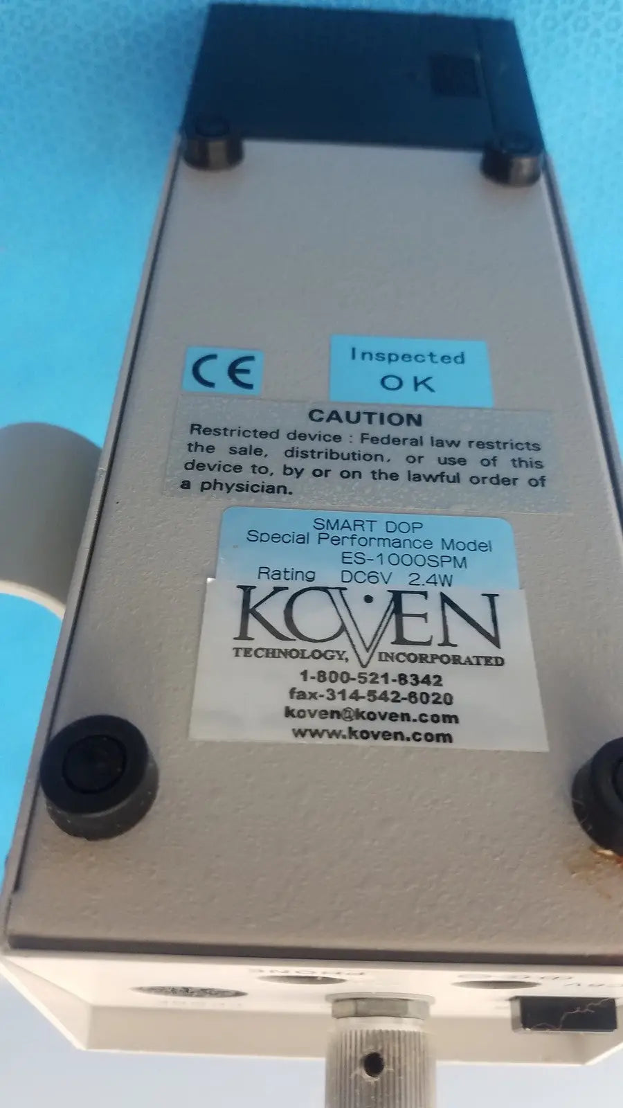 Silver metallic koven wave hadeco es-1000spm medical device with black plastic corners and mounting hardware
