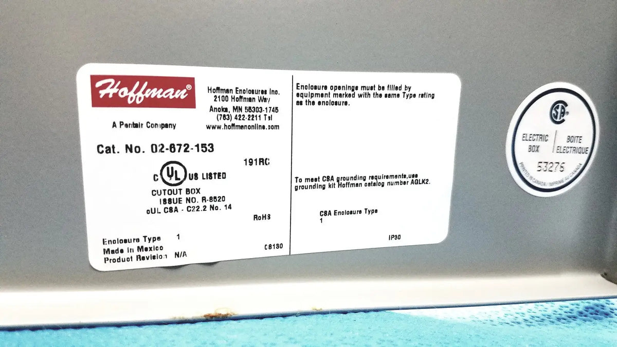 White rectangular label with red hoffman logo and product details on kryptonite cmt22a access control system