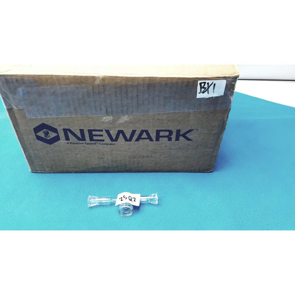 Clear glass lab glass adapter t-shaped connector with stopcock valve and white label 25 q2 affixed to center