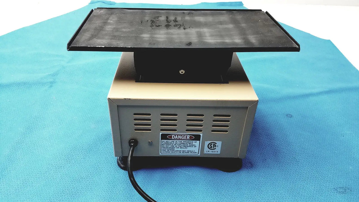 Black rectangular magnetic stirrer with beige base and ventilation slots for lab-line 4600 multi-mixer platform shaker lab equipment