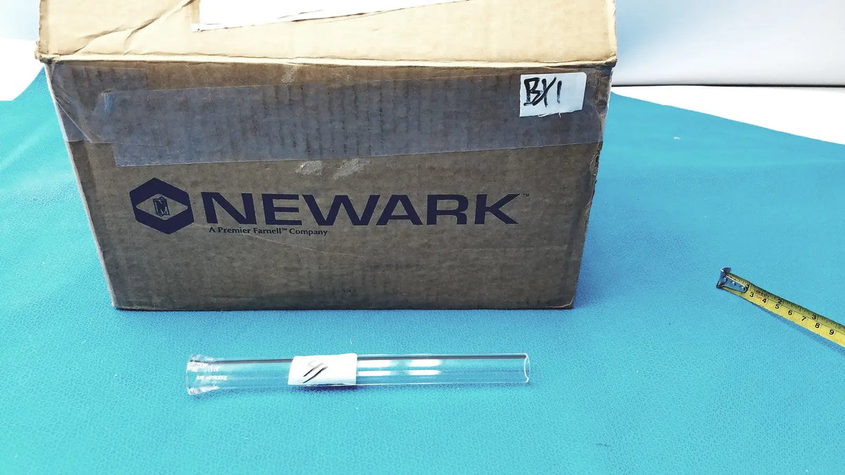 Clear glass laboratory digestion tube with white label and black markings made of high-temperature resistant borosilicate glass