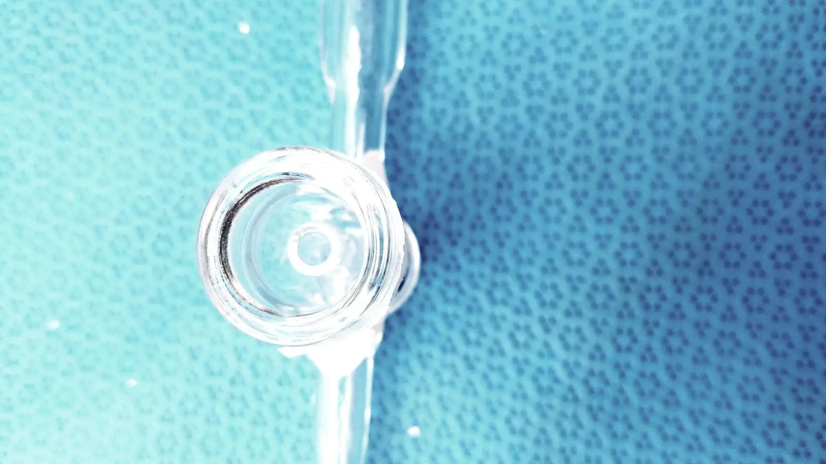 Clear glass laboratory glass adapter stopcock valve with cylindrical body and rounded tip borosilicate glass 24/40 joint