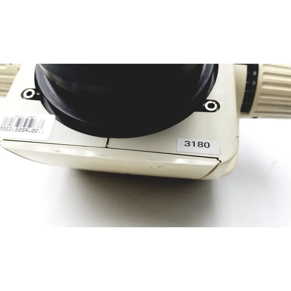 Cream-colored leica gz6e stereo zoom microscope base with black objective lens and numbered label 3180 for precision use