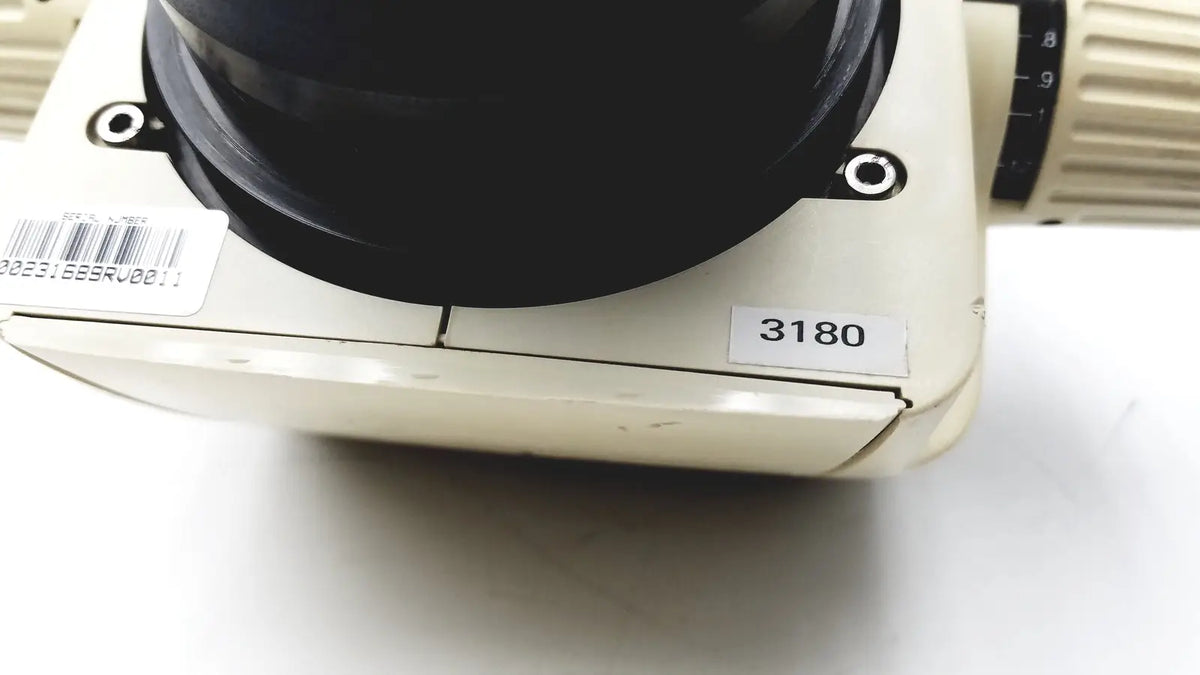 Cream-colored leica gz6e stereo zoom microscope base with black objective lens and numbered label 3180 for precision use