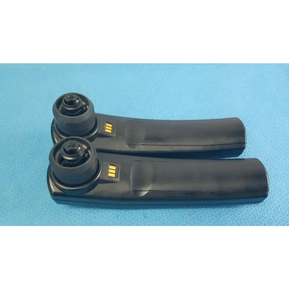 Lot of 2 maico ero scan pro black plastic handheld auditory remote controls with circular tops and yellow indicator lights for hearing screening medical equipment