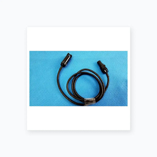 Black coiled mc4 solar connector extension cable with two black plastic connectors including threaded collar for reuse medical equipment