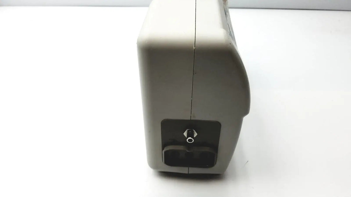 Beige plastic low air loss mattress pump with black panel and silver knob for air loss mattress control