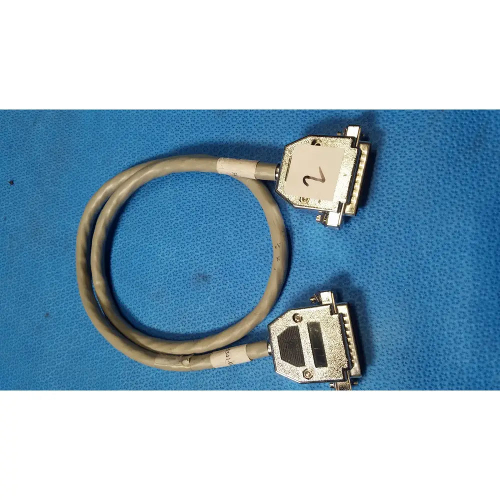 Gray coiled male pin connector data cable with two metallic d-sub connectors one labeled 2 for secure connections