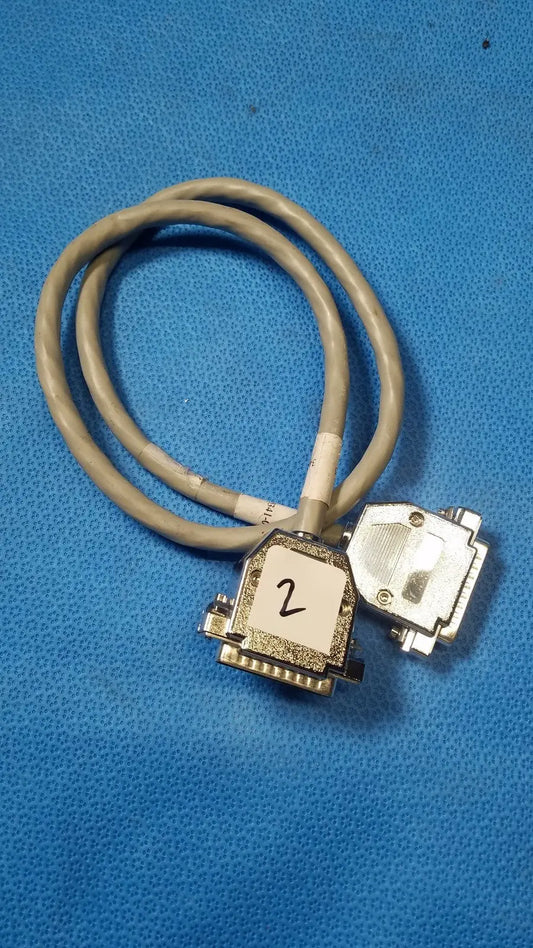 Gray coiled male pin connector data cable with two metallic d-sub connectors and one labeled 2 on white sticker
