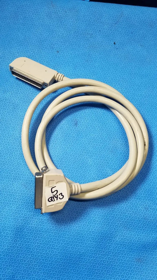 Beige coiled male to parallel port cable with two d-sub connectors one labeled 5 gy3 for parallel port use