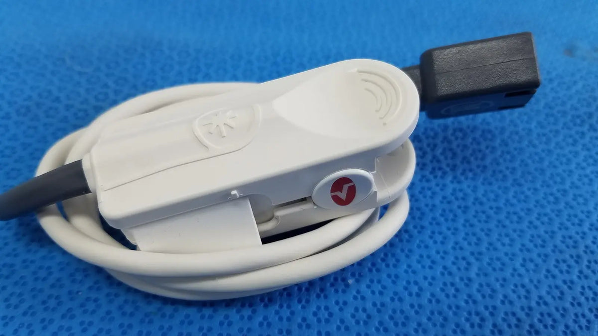 White plastic masimo lncs dci adult spo2 finger clip sensor with black connector and circular red logo