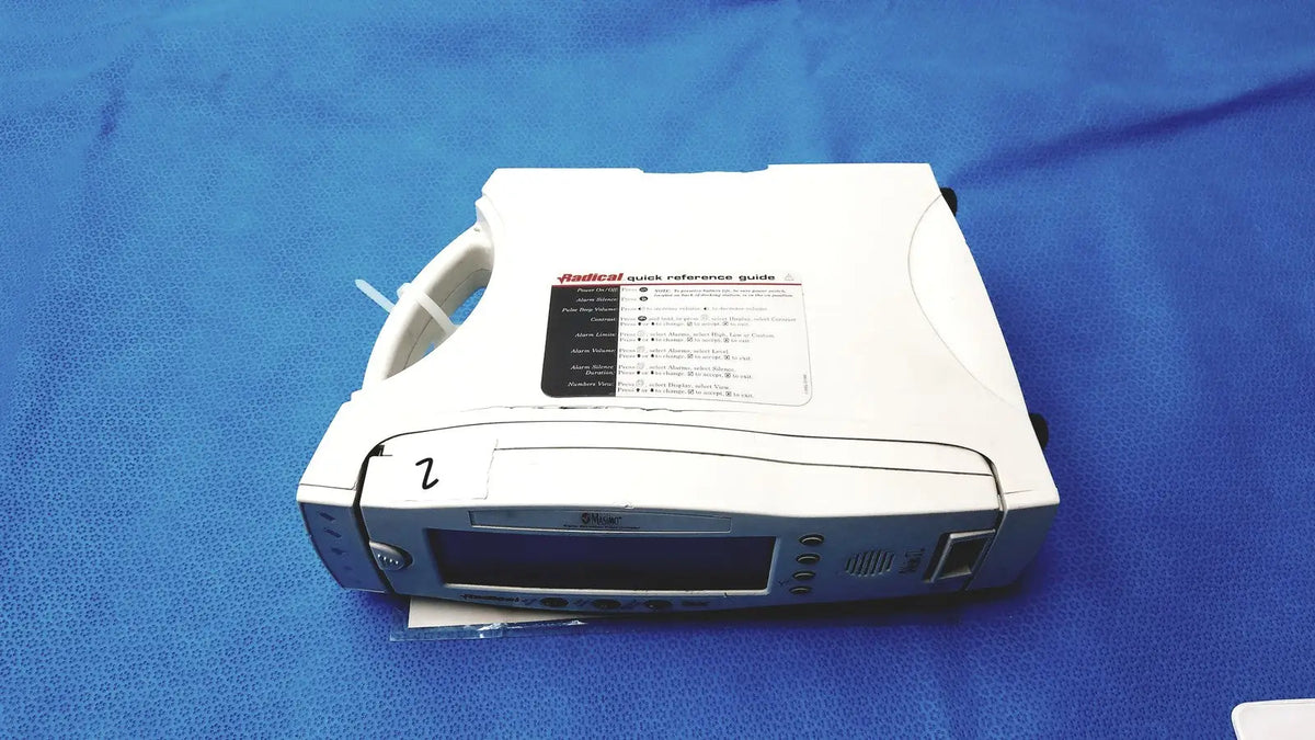 White masimo radical 7 pulse oximeter spo2 pulse monitor with digital display and control buttons for clinical use