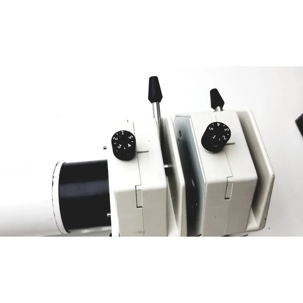 White plastic microscope with black adjustment knobs on masterflex i p digital modular drive modular drive unit