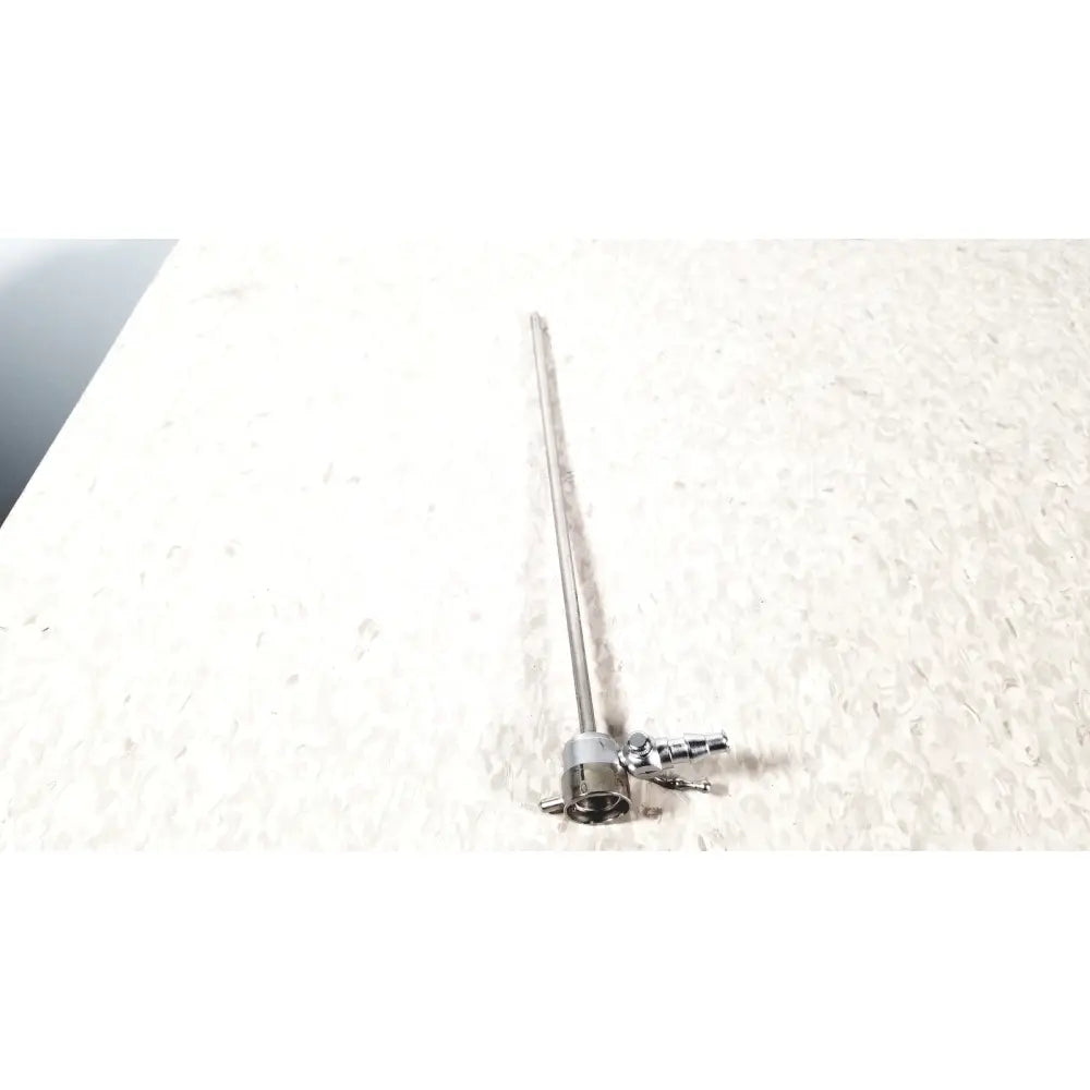 A metallic slender medical horizon endoscope single valve sheath with a cylindrical shaft and complex jointed base connectors