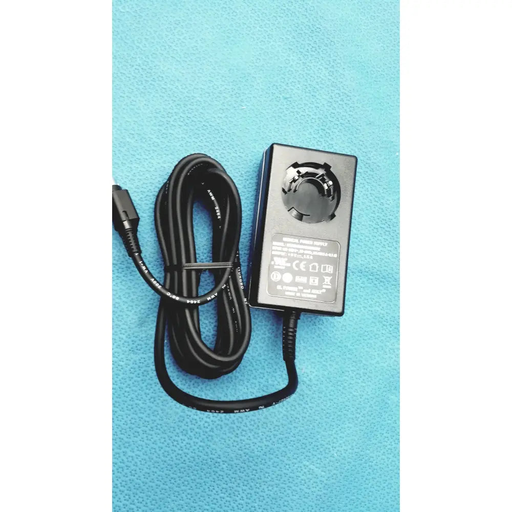 Black rectangular medical power supply with coiled cable and usb-c connector for covidien kangaroo feeding pump