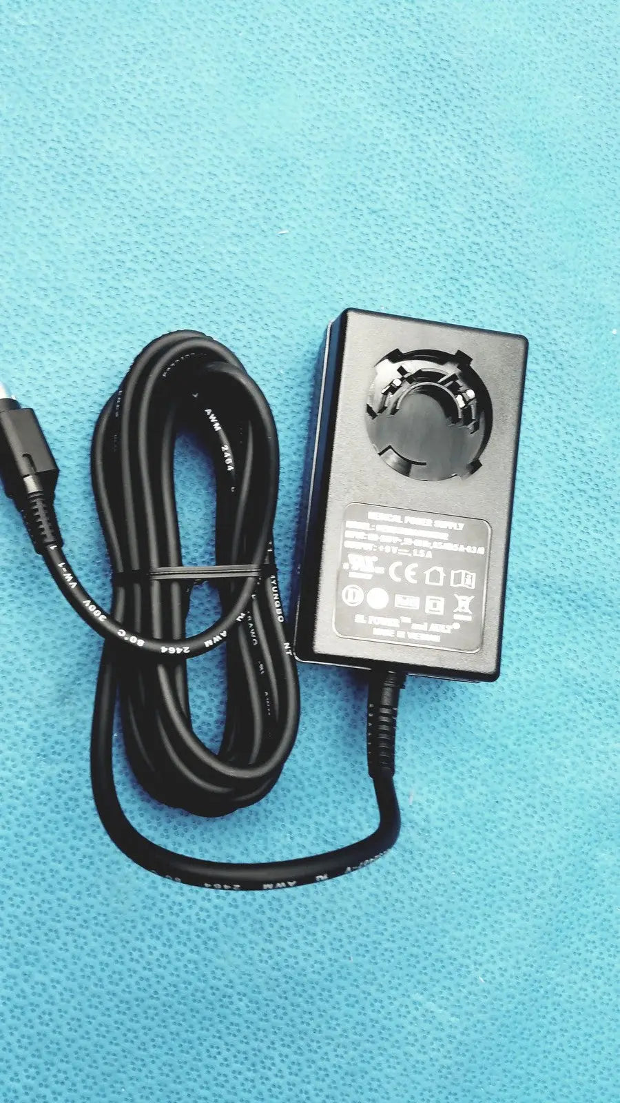 Black rectangular medical power supply with coiled cable and usb-c connector for covidien kangaroo feeding pump