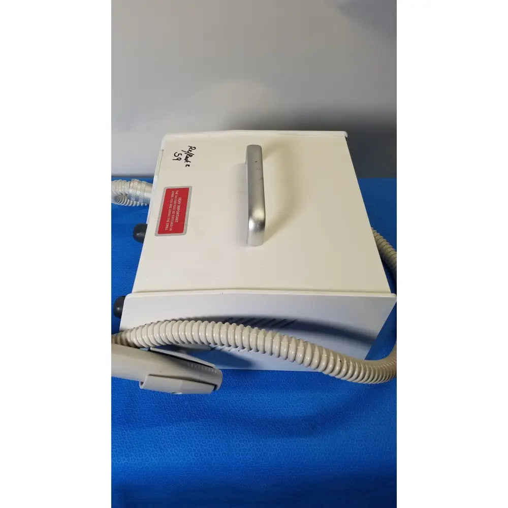 White rectangular medicool pro vac file v2 dust collector vacuum system with silver handle and beige coiled tubing