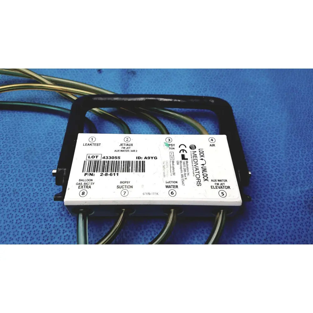 White rectangular medivators hook-up connector assembly 433055 with black plastic housing and labeled ports for air water and gas