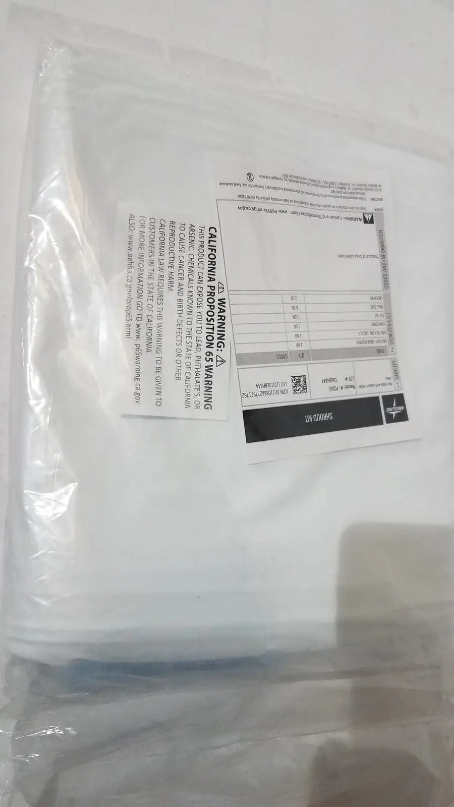 White plastic medline post mortem body bag heavy duty disposable with printed warning label and barcode visible