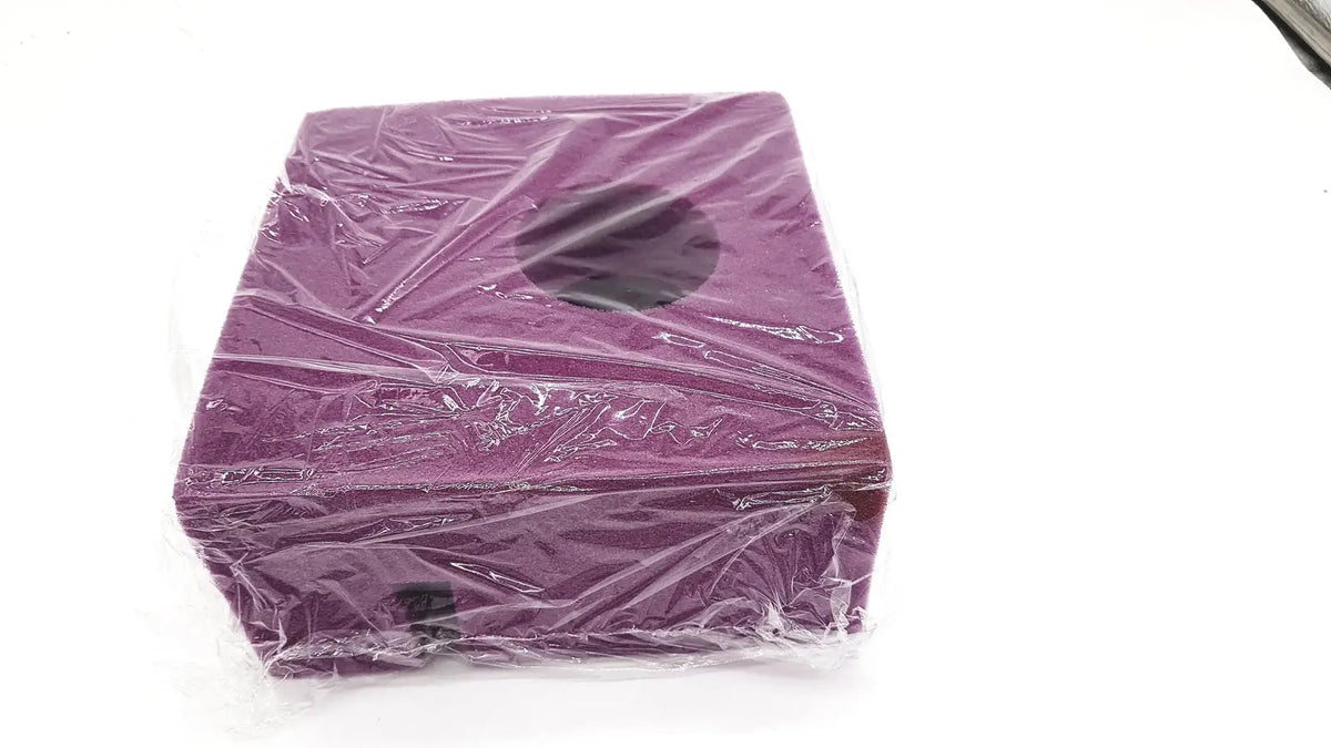 Medline single use slotted foam head positioner in a purple rectangular box wrapped in clear plastic with circular cutout on top