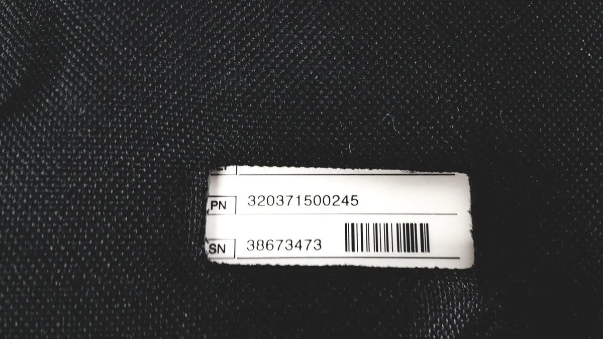 White rectangular label with black barcode and alphanumeric codes on back of medtronic lifepak 1000 defibrillator case for reuse medical quik-pak pads
