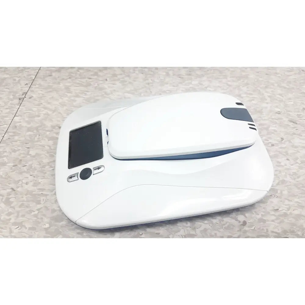 White sleek robotic vacuum cleaner with small screen and control buttons side for medtronic mycarelink remote patient monitor