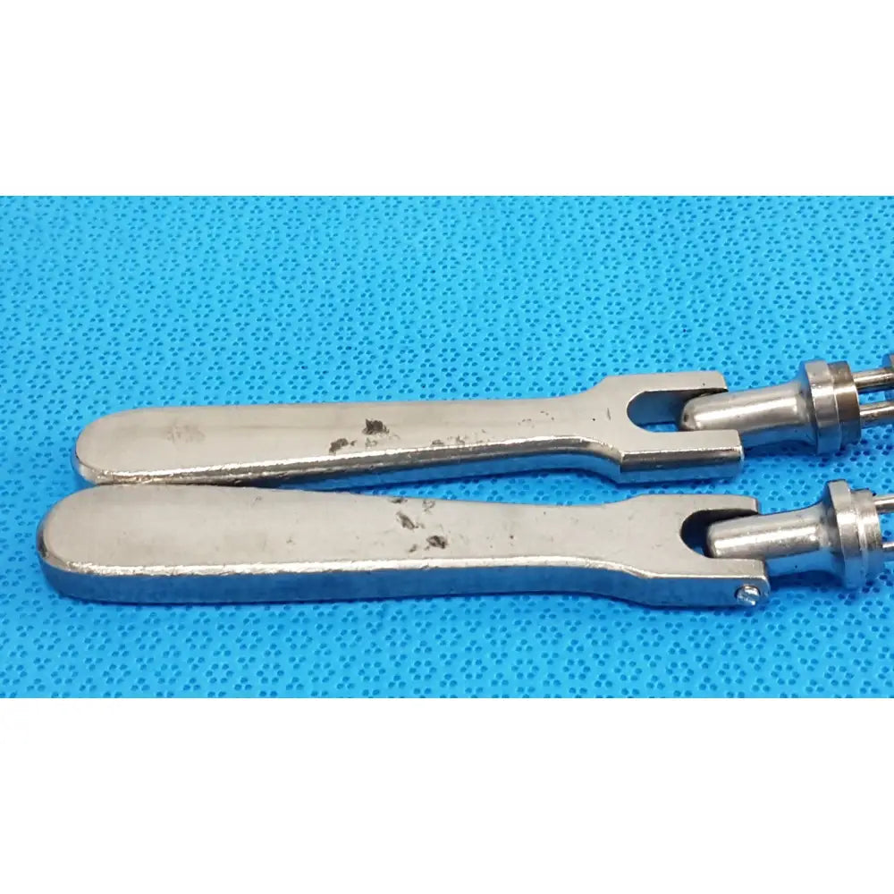 Silver-toned metal medtronic octobase retractor handle with u-shaped design smooth finish lot of 2 surgical positioning components