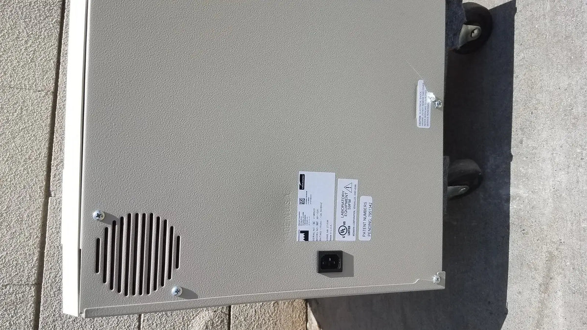 Gray metal industrial enclosure with vented panel and power input port on back of midmark ritter m11-022 ultraclave autoclave steam steri