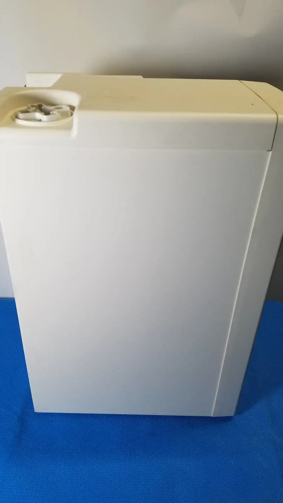 White plastic washing machine with circular control panel for millipore elix essential 5 uv water purification system