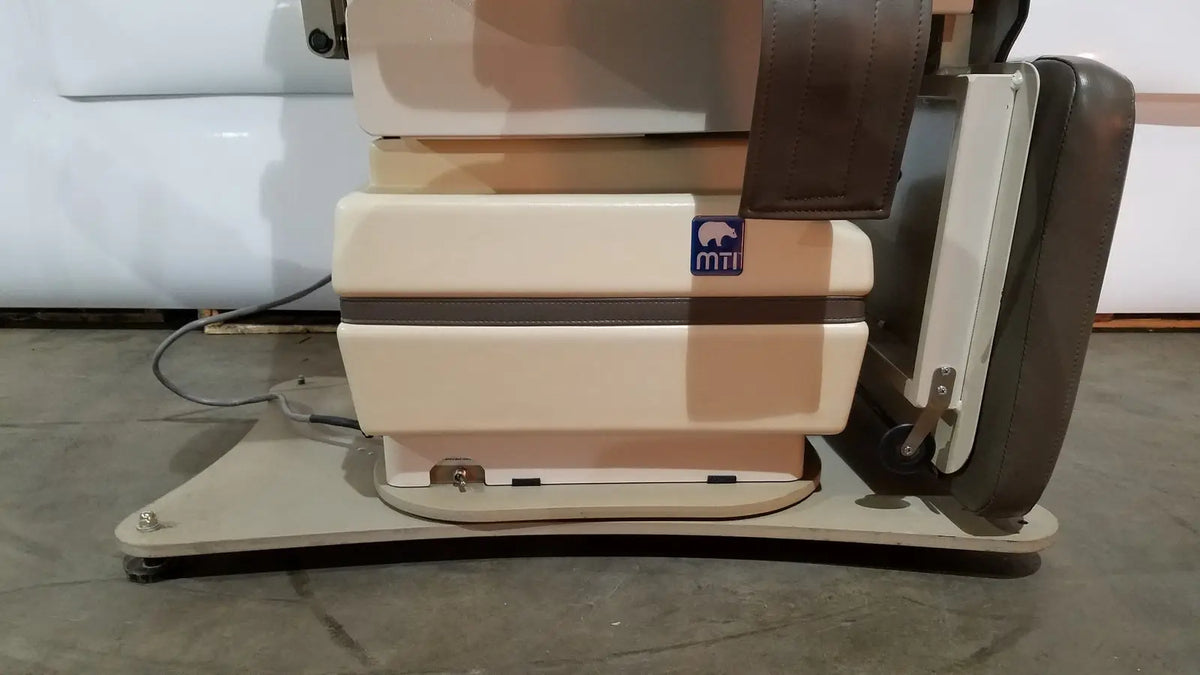 Beige and brown mti programmable podiatry chair with foot control featuring sleek modern design and premium materials