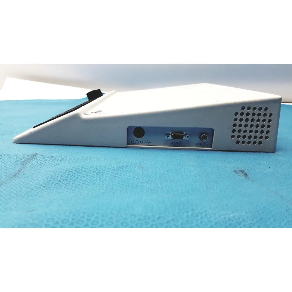 White plastic natus ultrapro s100 unit control panel with triangular shape featuring rs-232 serial port and audio jacks on side