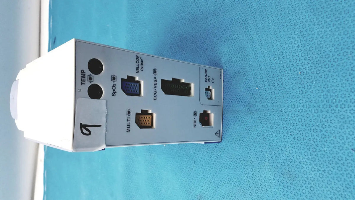 White rectangular nihon kohden ay-651p multi-parameter module with multiple ports and labeled connectors on back side