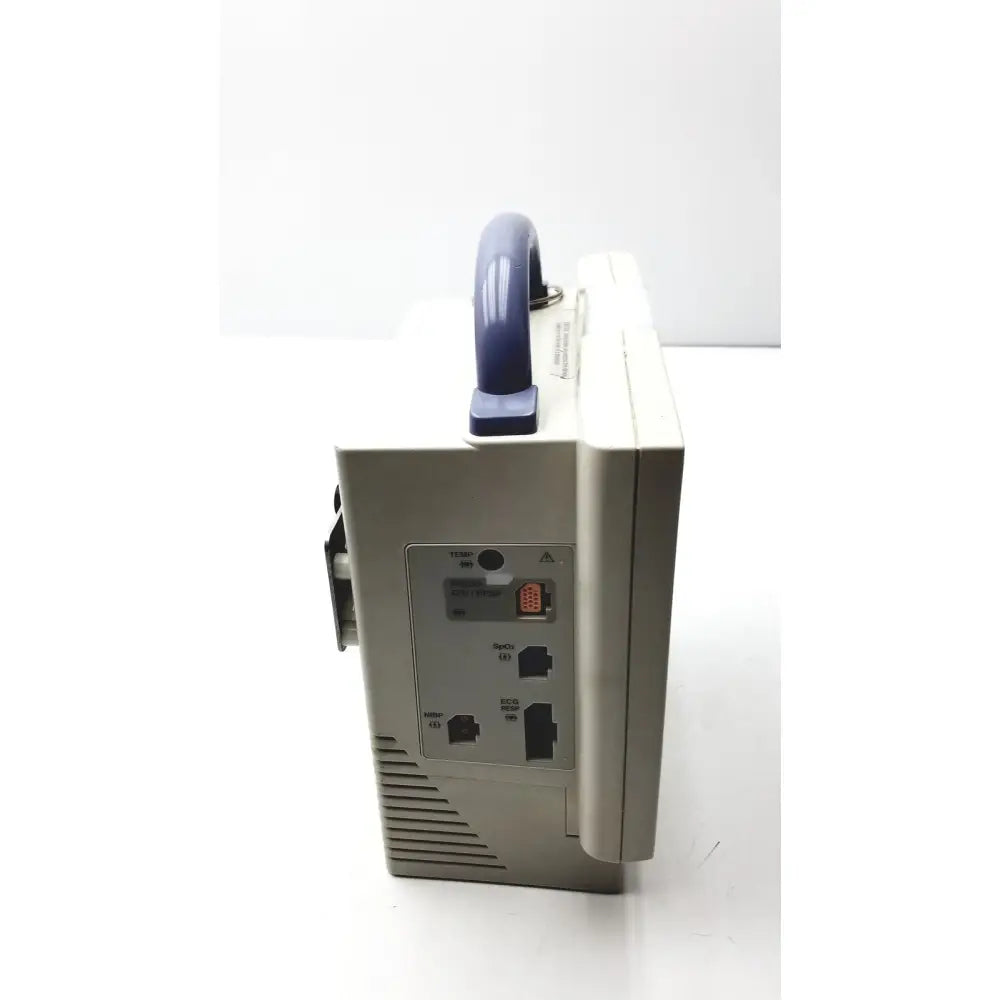 Beige nihon kohden bsm-2351a bedside patient monitor with blue handle and multiple ports on the back side