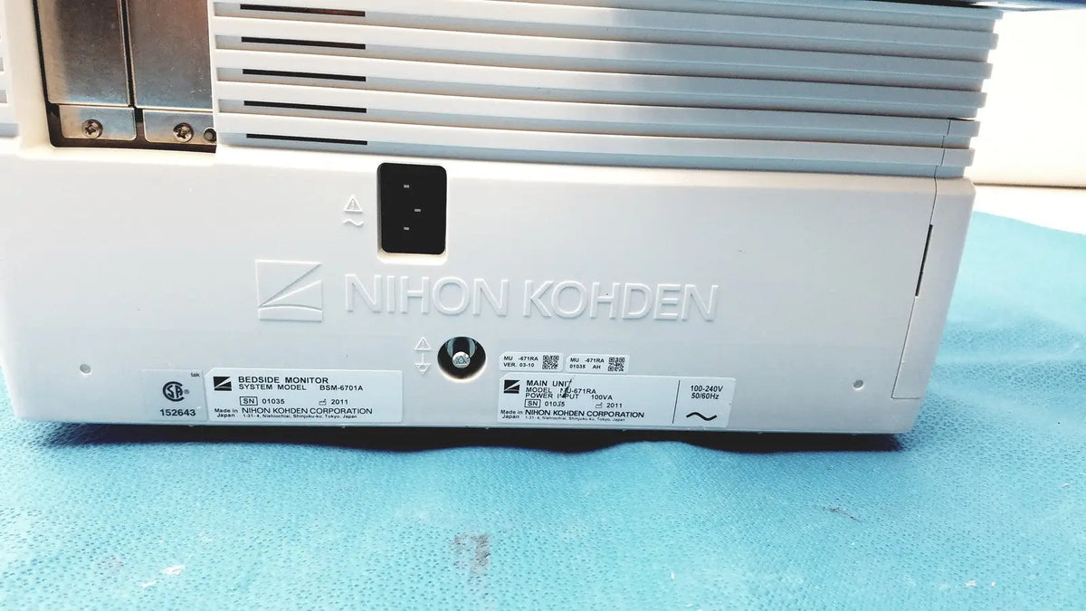 White plastic nihon kohden lifescope bedside patient monitor showing silver vented grille and black power port view