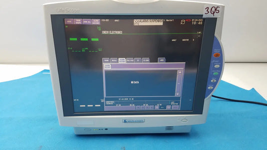 White plastic nihon kohden lifescope bedside patient monitor displaying digital patient data with side controls