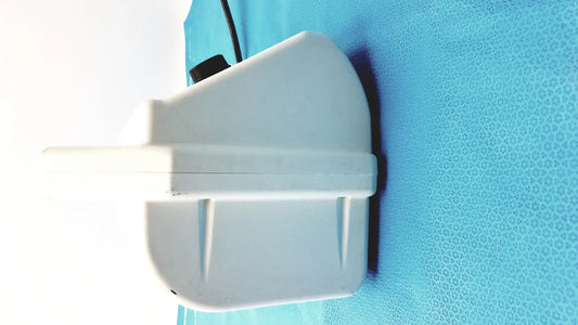 White plastic ohio care-e-vac 3 portable suction pump medical unit with black knob and angular design
