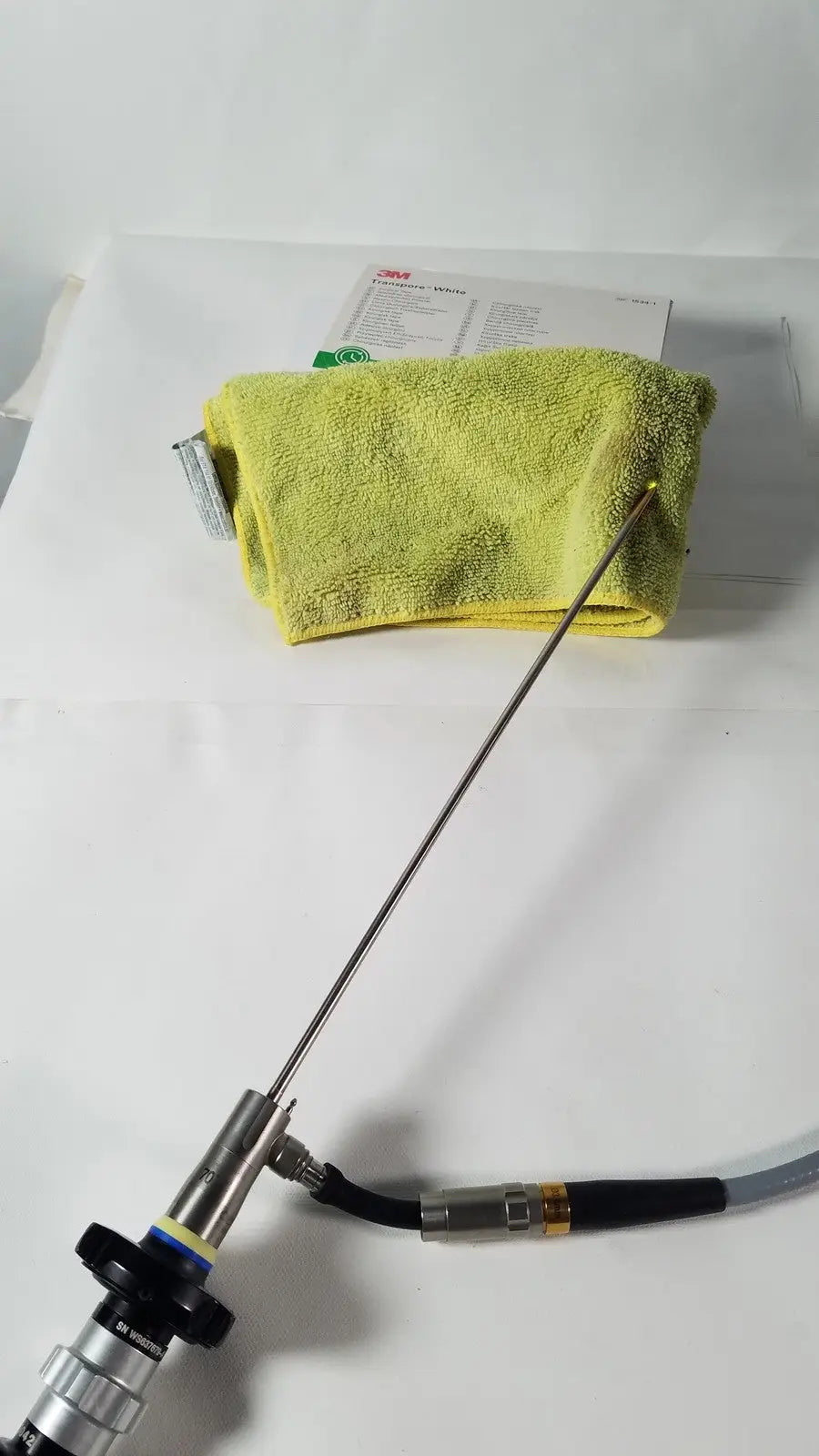 Olympus 4mm 70 degree rigid scope with long slender metallic shaft and black-handled control section medical endoscope