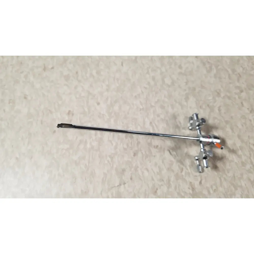 Silver-colored olympus a3722 pediatric sheath instrument with long slender shaft and articulated jointed end for medical use